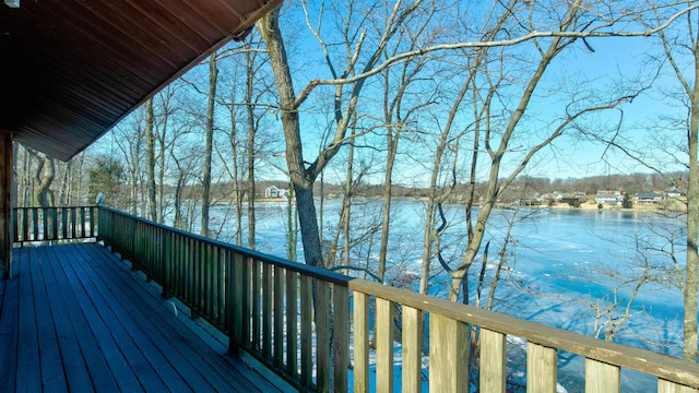 wooden deck featuring a water view