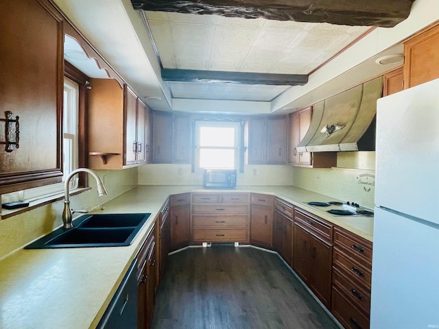 kitchen featuring dark wood-type flooring, sink, white appliances, and range hood