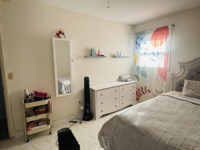 bedroom featuring a textured ceiling