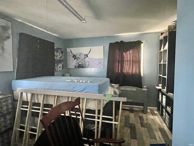 bedroom featuring wood-type flooring