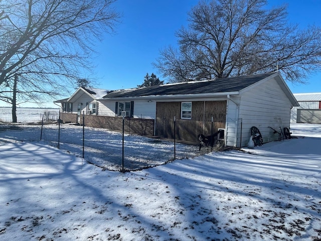 view of snow covered house