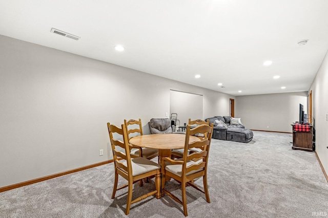 dining area with light carpet