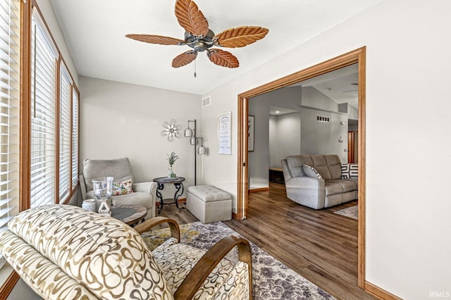 living room with ceiling fan and wood-type flooring