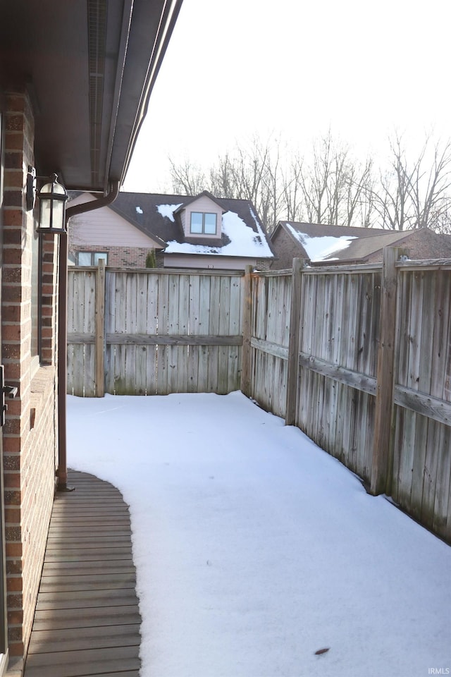 view of yard covered in snow