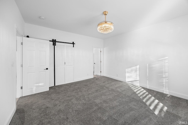 unfurnished bedroom with dark colored carpet