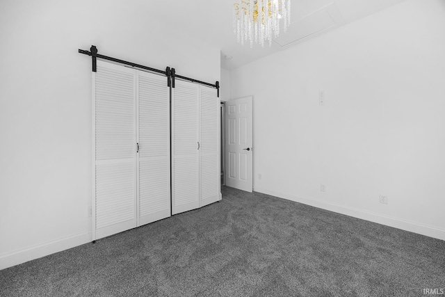 unfurnished bedroom with dark carpet