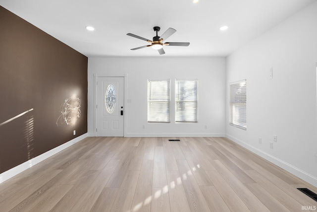 entryway with ceiling fan and light wood-type flooring