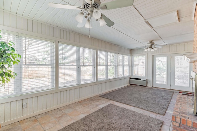 unfurnished sunroom featuring ceiling fan