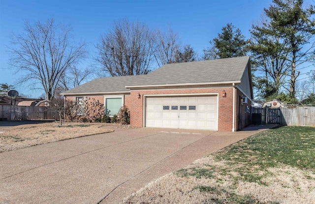 view of front of property featuring a front yard and a garage