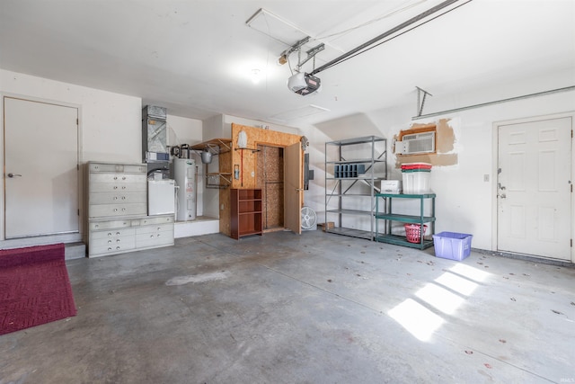 garage with electric water heater and a garage door opener