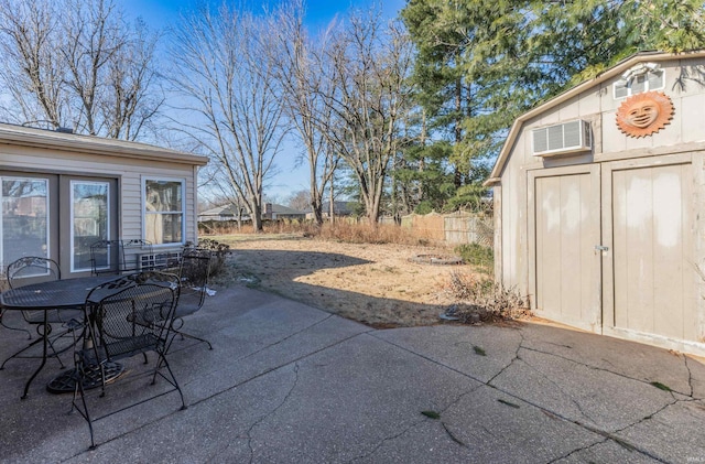 view of patio featuring a storage unit