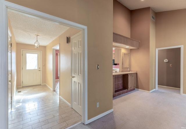 hallway featuring a textured ceiling