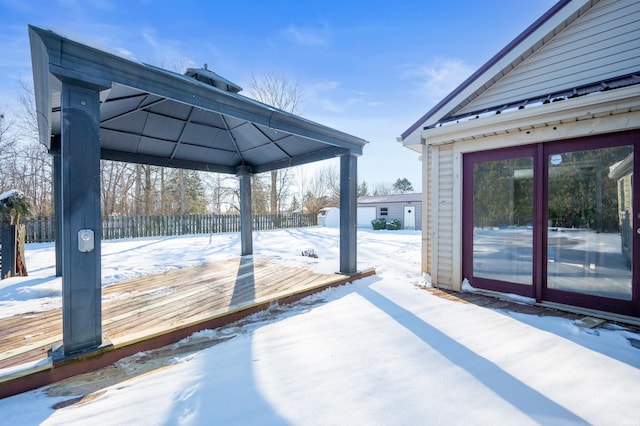 snow covered deck featuring a gazebo