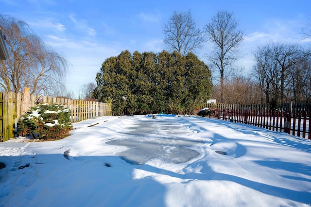 view of yard layered in snow