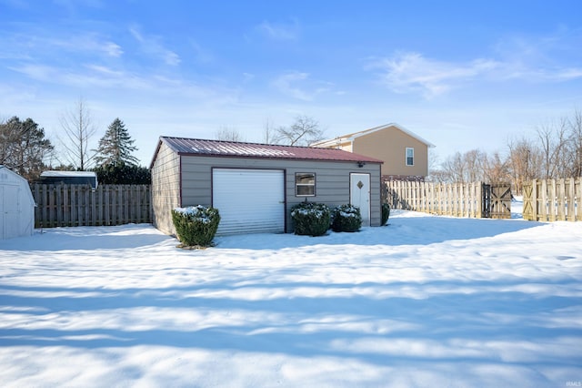 view of snow covered garage