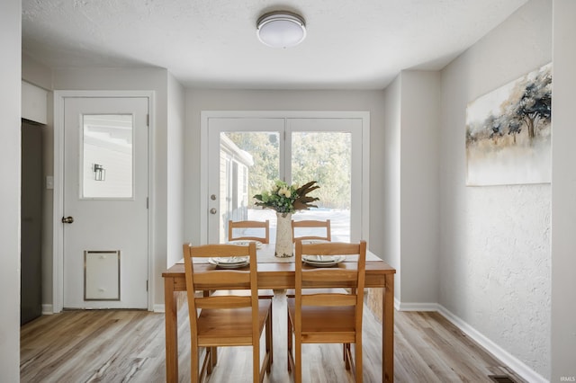 dining area with light wood-type flooring