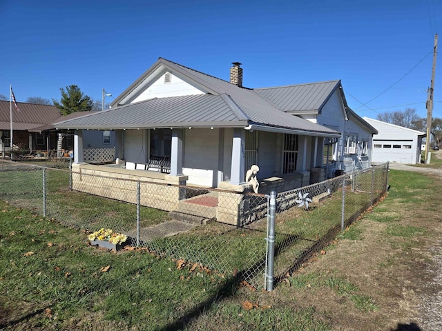 exterior space featuring covered porch and a garage