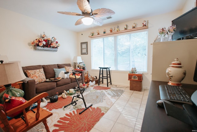 living room featuring ceiling fan and light tile patterned flooring