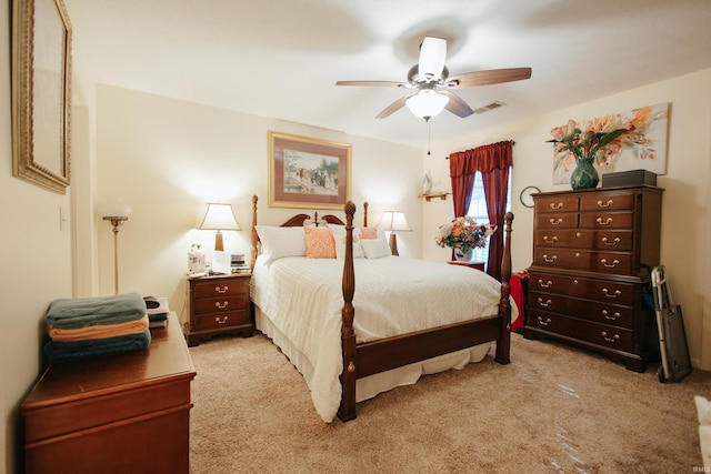 bedroom featuring ceiling fan and light carpet