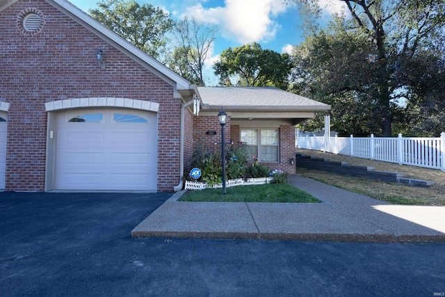 view of front of home featuring a garage