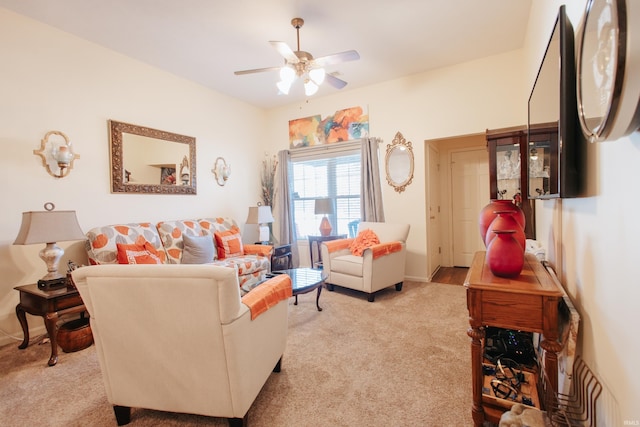 living room featuring light carpet and ceiling fan