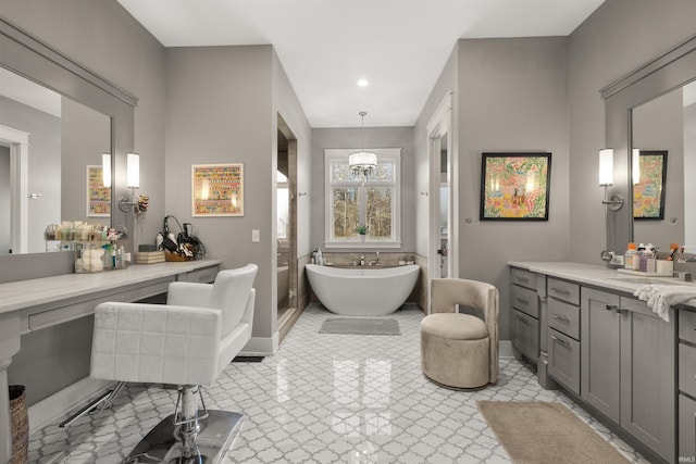 bathroom with vanity and a washtub