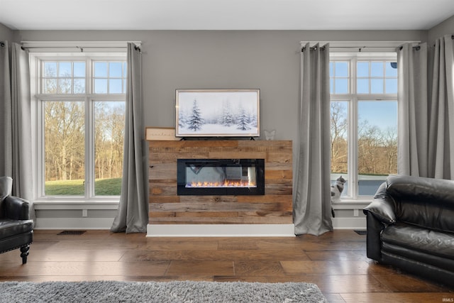 living room with dark hardwood / wood-style flooring