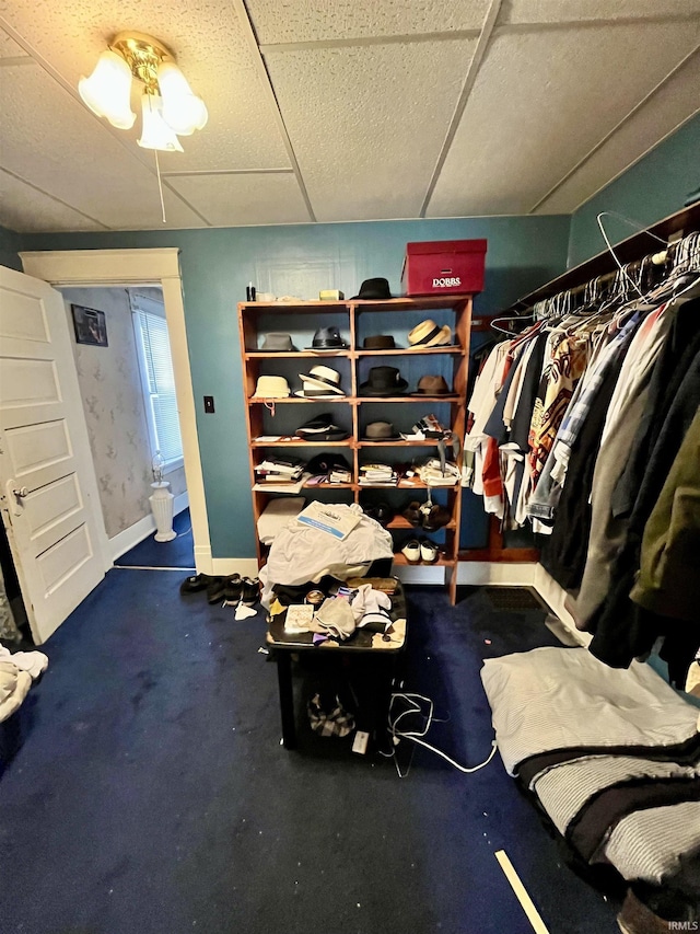 spacious closet with a drop ceiling