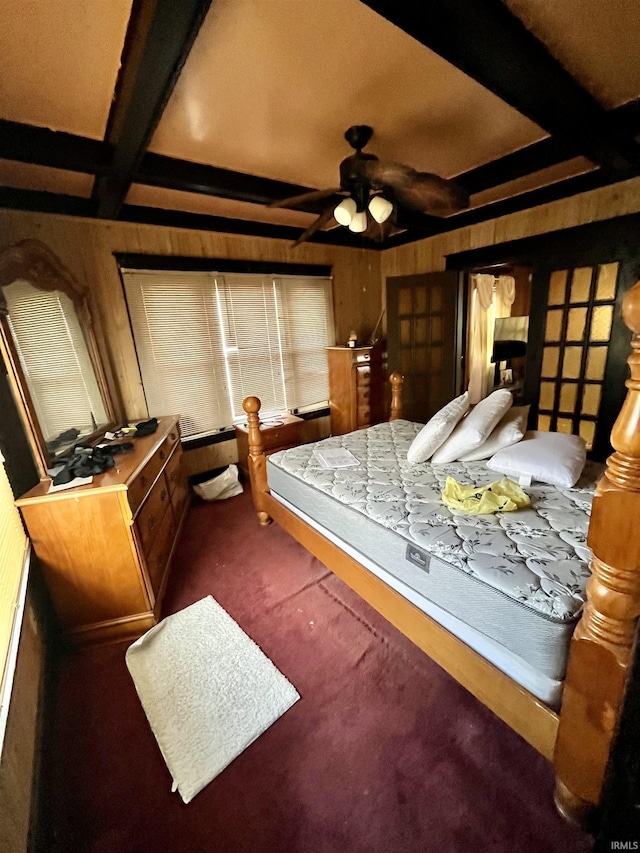 carpeted bedroom featuring beam ceiling, coffered ceiling, and wooden walls