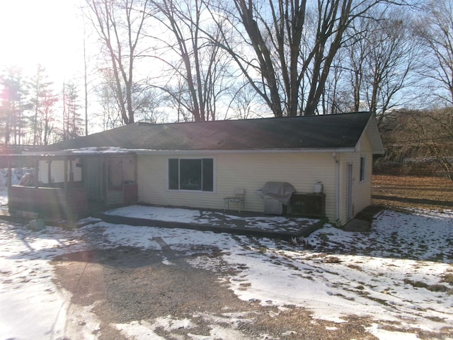 view of snow covered house