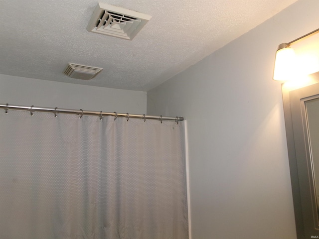 bathroom featuring a textured ceiling