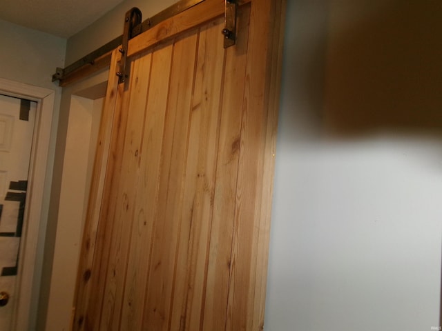 interior details featuring a barn door