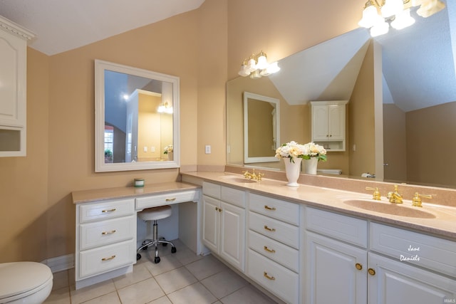 bathroom featuring tile patterned floors, vanity, lofted ceiling, and toilet