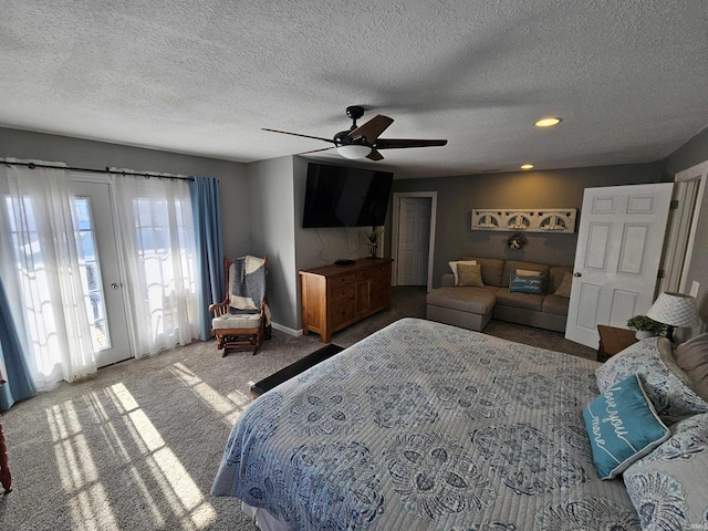 carpeted bedroom with a textured ceiling, ceiling fan, and access to outside