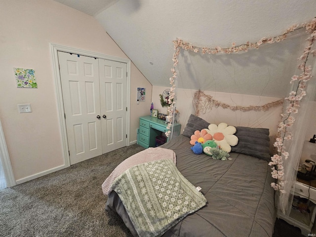 bedroom with a closet, vaulted ceiling, and dark carpet