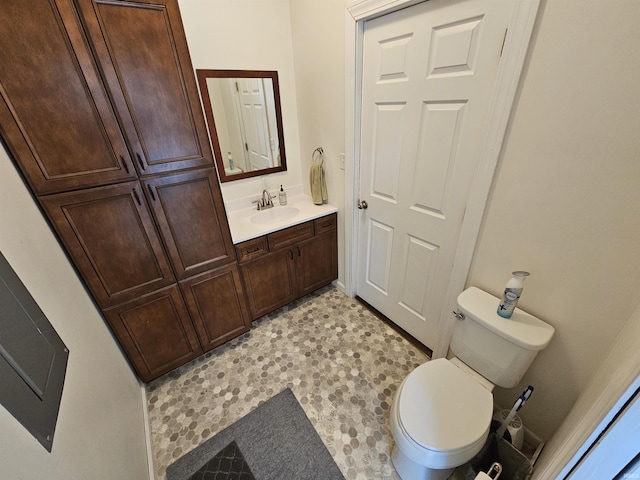 bathroom featuring toilet and vanity