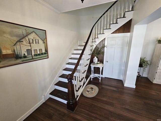 stairs featuring hardwood / wood-style flooring and crown molding