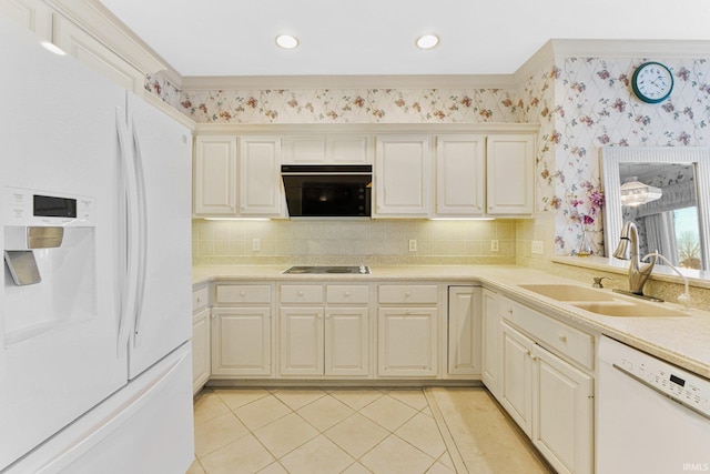 kitchen featuring decorative backsplash, sink, light tile patterned floors, and black appliances