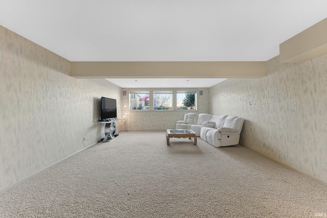 carpeted living room featuring beam ceiling