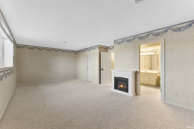 unfurnished living room with light carpet