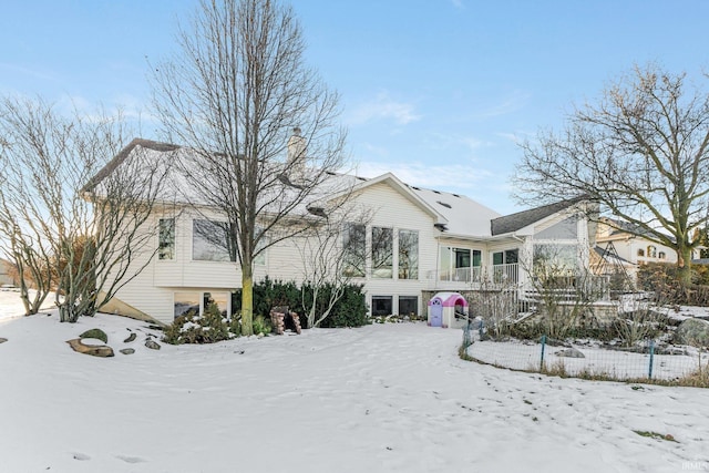 view of snow covered house