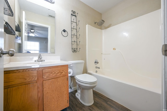 full bathroom with shower / bathing tub combination, vanity, toilet, and hardwood / wood-style floors