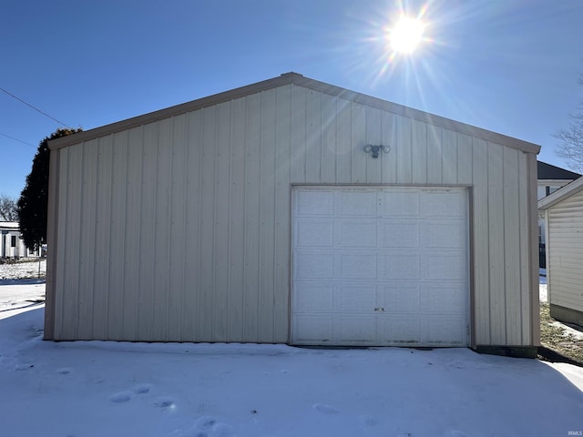 view of snow covered garage