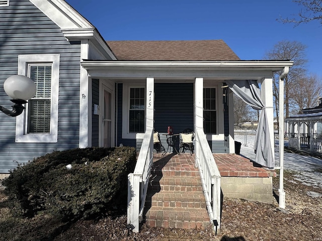 property entrance featuring covered porch