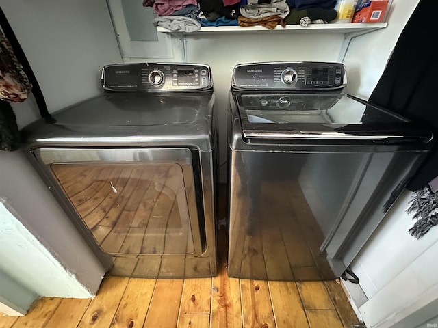 washroom featuring washer and dryer and hardwood / wood-style floors