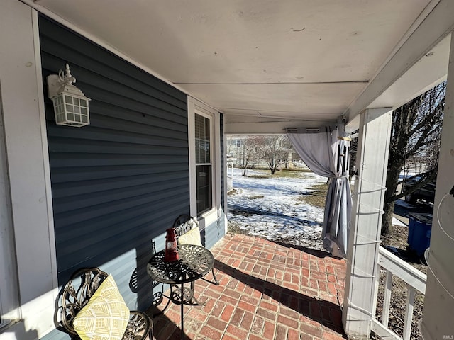 view of snow covered patio