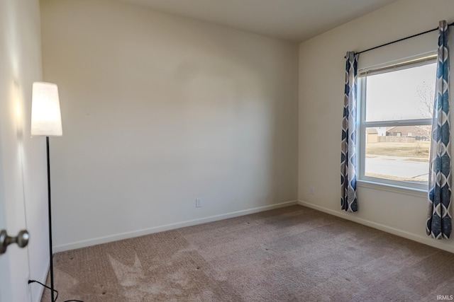 carpeted empty room with a wealth of natural light