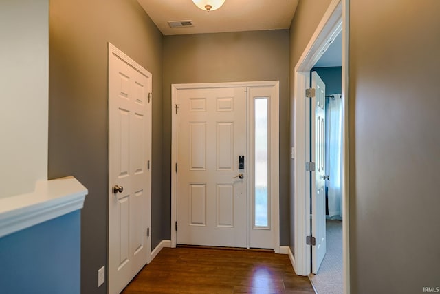 entrance foyer with dark hardwood / wood-style floors