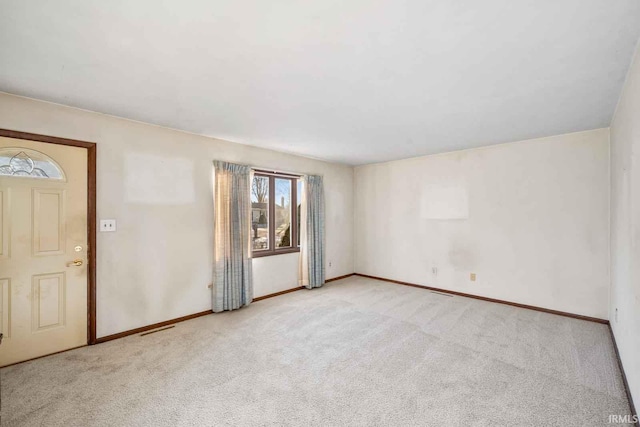 empty room with light colored carpet