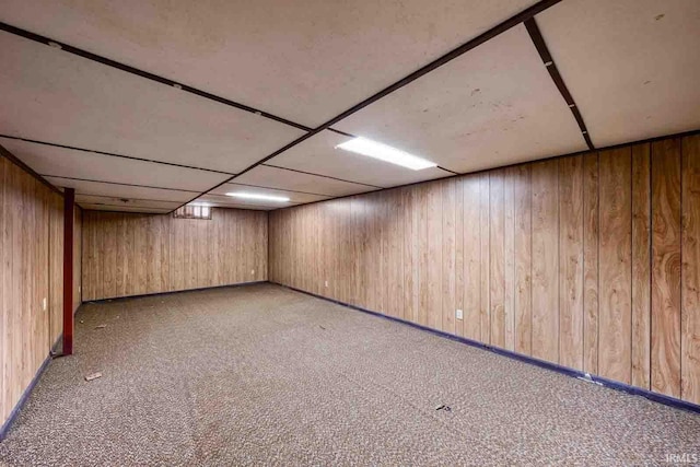 basement featuring light colored carpet